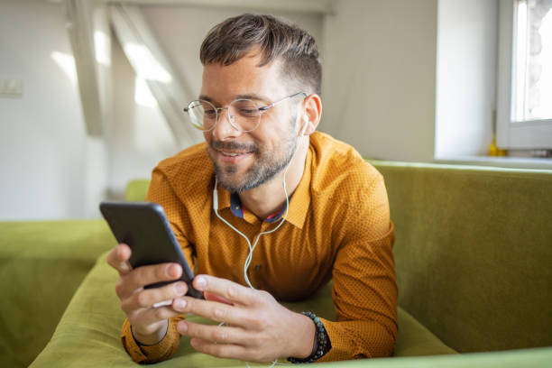 istock Shot of a young man using his smartphone 1473377876