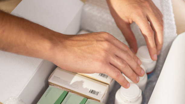 istock Person hands searching medicine in box 1473378161