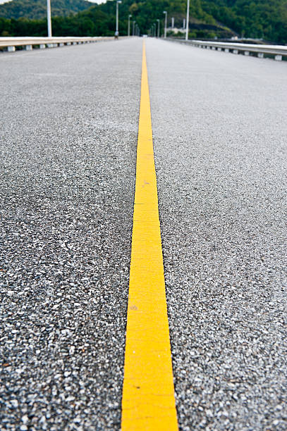 istock yellow line on the road 147337915