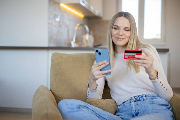 istock Happy young customer enjoys shopping online 1473379190