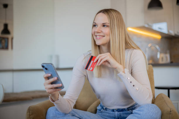 istock Happy young customer enjoys shopping online 1473379205