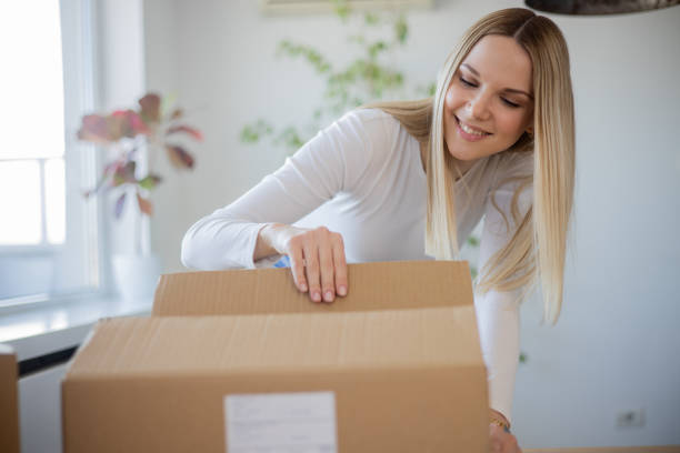 istock Young entrepreneur is sending a package to a customer 1473379259