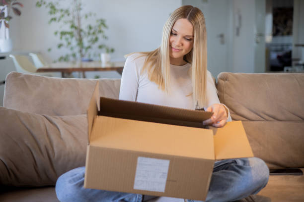 istock Young entrepreneur is sending a package to a customer 1473379264