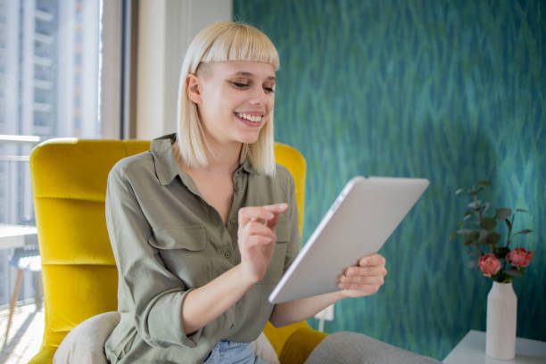 istock Happy young customer enjoys shopping online 1473379331