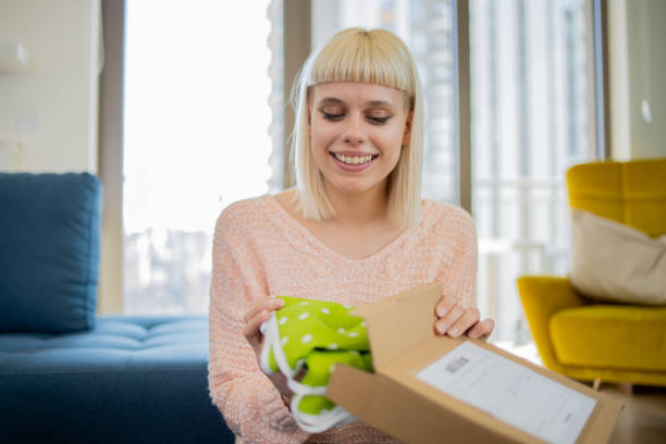 istock Young entrepreneur is sending a package to a customer 1473379350
