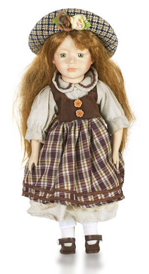 Doll in national Czech clothes isolated on white