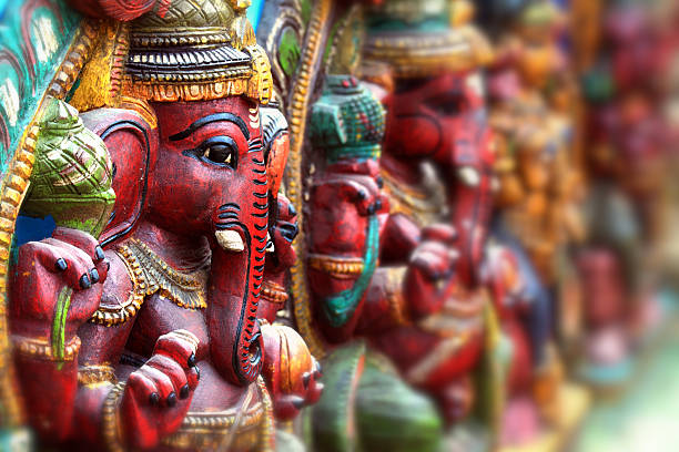 A close-up of Hindu god statues Wooden Sculpture of Lord Ganesha caste system stock pictures, royalty-free photos & images