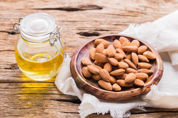 istock Almond oil and seeds (Prunus dulcis) close-up image 1473382539