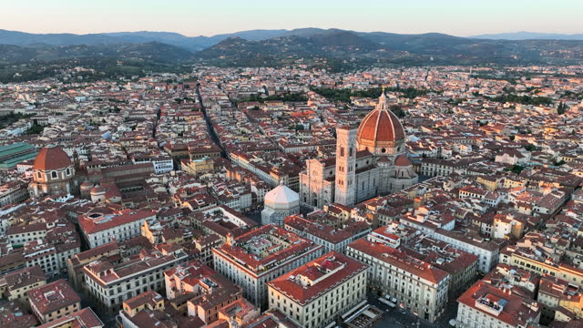 Aerial drone Sunset scene view of Firenze old town and Piazza del Duomo in Florence, Italy. Duomo di Santa Maria del Fiore, the famous Cathedral of Florence