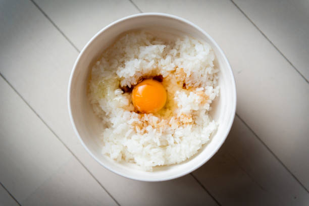 istock Japanese style raw egg over hot rice 1473389833