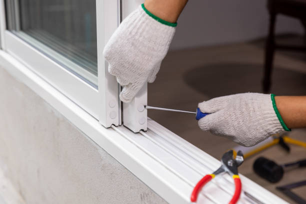 istock Construction worker repairing the sliding window. Open cap of adjust rail wheel. 1473402427