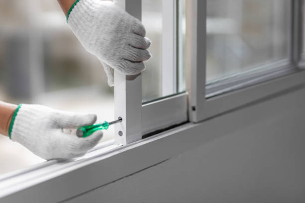istock Construction worker repairing the sliding window. Open cap of adjust rail wheel. 1473402453
