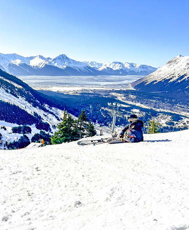 Winter scenery with people skiing at the peak of French alps