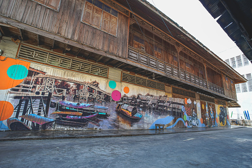 Suphan Buri, Thailand - December 11, 2022: Colorful graffiti on the wall at Samchuk old market, Suphan Buri province, Thailand.