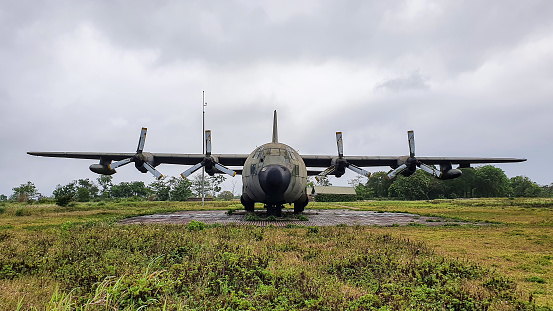 Quang Tri, Vietnam - March 21, 2021 : Lockheed C-130 Hercules Aircraft In Ta Con Airport Relics. Ta Con Airport Is Now A Famous Historical Relic In Quang Tri Attracting Tourists To Visit And Explore.