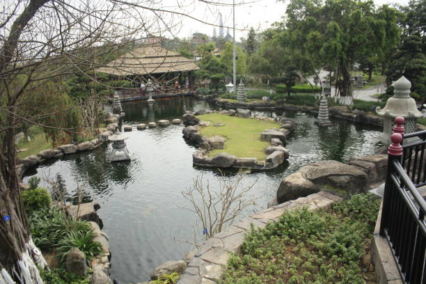 istock Asian theme garden with pond and memorial 1473409978