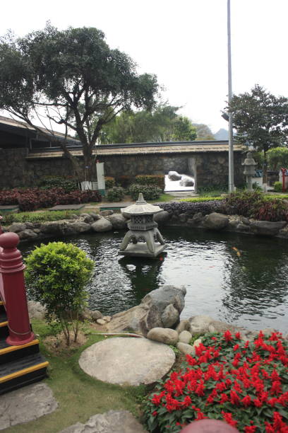 istock Asian theme garden with pond and memorial 1473409988