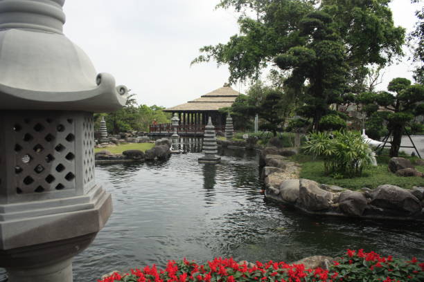 istock Asian theme garden with pond and memorial 1473409991