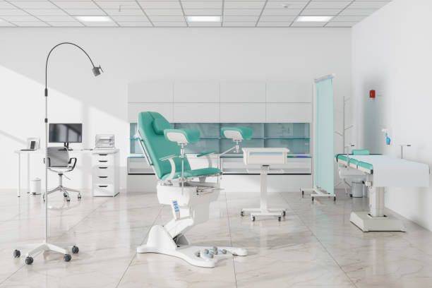 istock Empty Gynecologist Office With Gynecological Chair, Examination Table, Computer And White Cabinet 1473412507