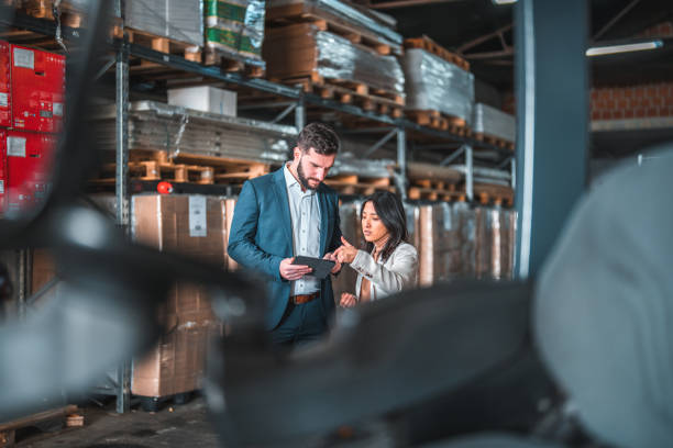 istock Multiracial Corporate People Using A Digital Tablet While In A Meeting At A Warehouse 1473416732