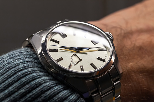 Automatic male wrist watch close-up photo with selective soft focus