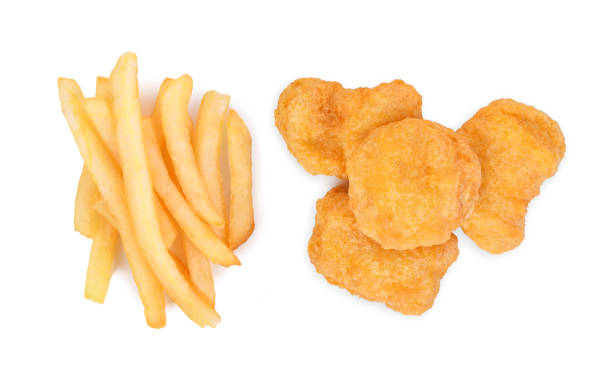 istock French fries and Chicken nuggets isolated on white 1473418053