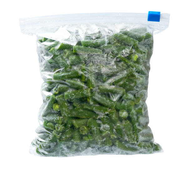 Frozen food vegetables in a plastic bag. Frozen green beans  in a plastic bag. Deep freezing of vegetables.