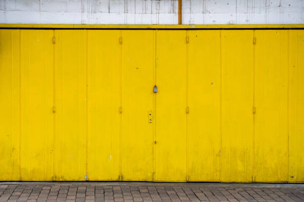 istock yellow metal door with wall 1473420299
