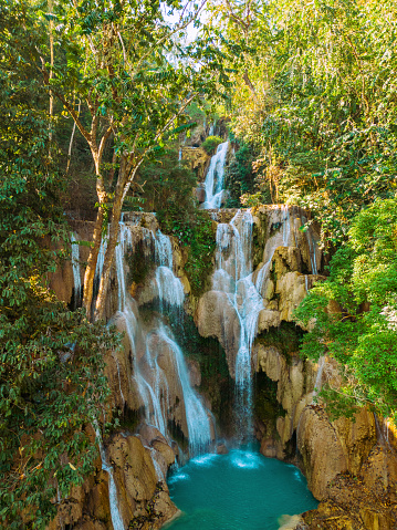 Scenic aerial view of refreshing  Kuang Si waterfall in the jungles