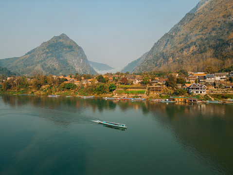 Scenic aerial view of boat on Mekong River at sunset