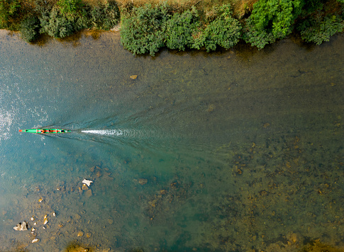 Scenic aerial view of longtail boat  on the river in summer