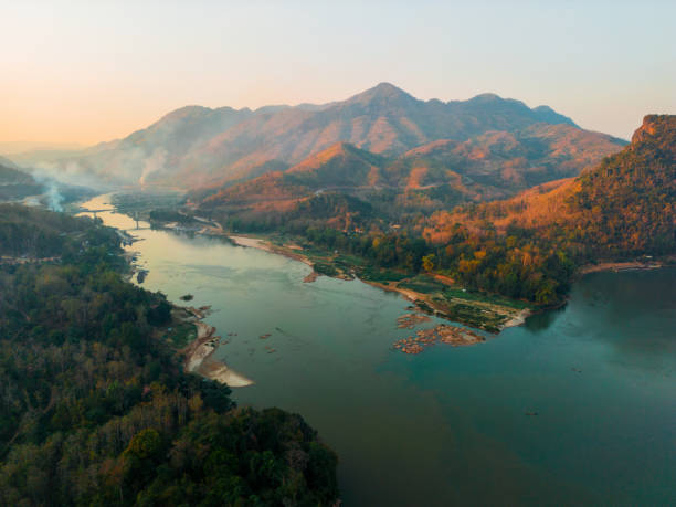 Aerial view of tranquil scene of Mekong river at sunset Aerial view of tranquil scene of Mekong river at sunset laos stock pictures, royalty-free photos & images