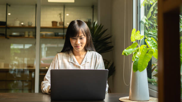 istock Asian woman work from home. 1473432889