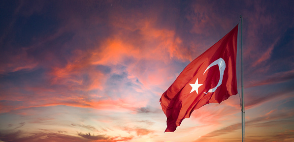 Turkish flag. Turkey national flag. Turkish flag at sunset. Empty space for text. Copy space