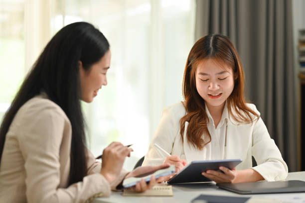 istock Start up business women are brainstorming, collaborating on project development in corporate office. 1473434833