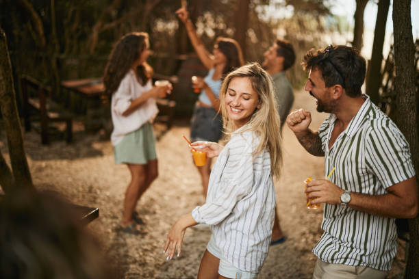 istock Cheerful couple dancing during spring party in nature. 1473435253