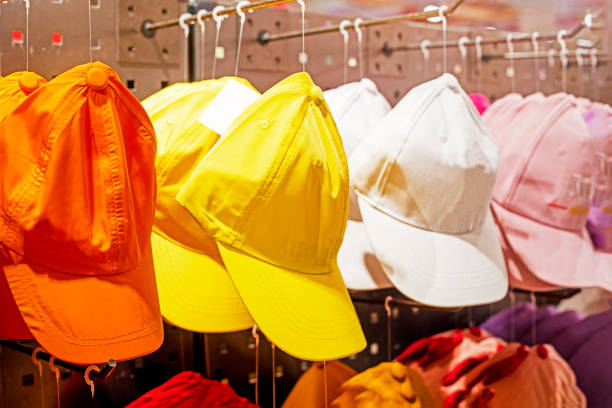 istock multi-colored summer caps in the store. Summer is coming 1473435479