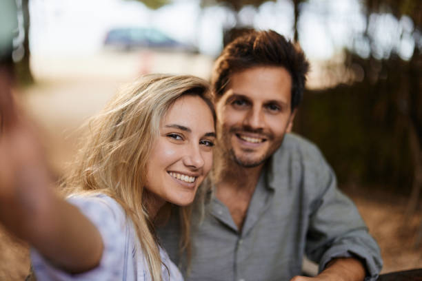 istock Happy couple taking a selfie in summer day. 1473436272
