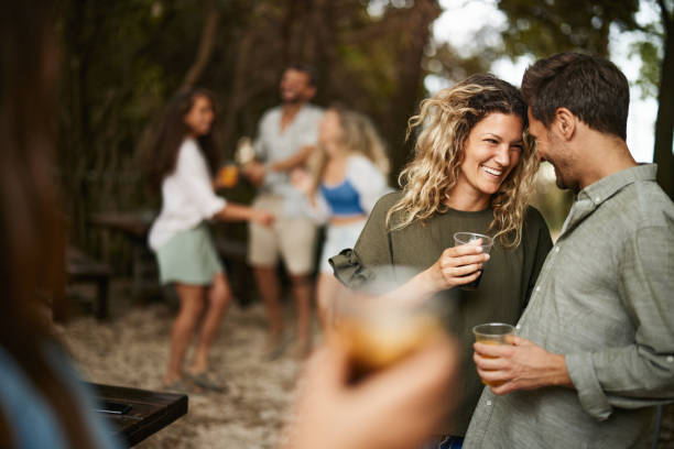 istock Cheerful couple talking during spring party in nature. 1473436413