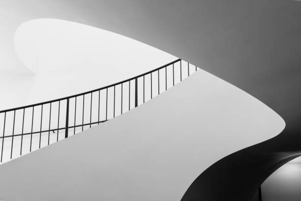 istock Lateral partial view of a curved spiral staircase 1473437252