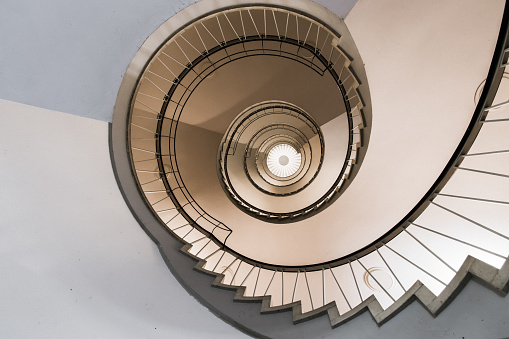 dizzying interior view of a spiral staircase from floor to ceiling