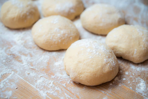 istock Closeup of dough on wood table 1473437438