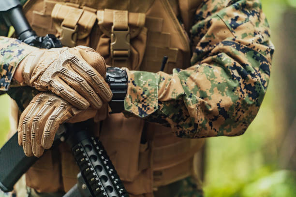 istock American marine corps special operations soldier preparing tactical and commpunication gear for action battle closeup 1473441072