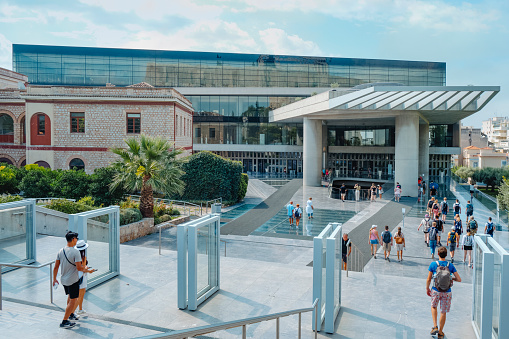 Athens, Greece - August 31, 2022: Some groups of tourists are about to enter to the Acropolis Museum in Athens, Greece, on a summer day
