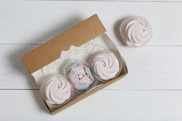 istock Homemade marshmallows in a cardboard box. Zephyr flowers. Gift wrap. 1473441966