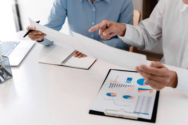 istock Business sales consultant discussing in data documents at modern office. 1473442208