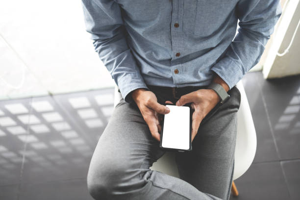 istock Close up of male hands using cellphone, Gadget and technology concept. 1473442216