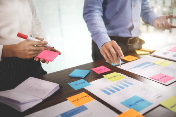 istock Business sales consultant discussing in data documents at modern office. 1473442241