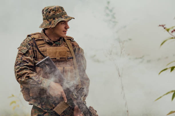 istock A soldier fights in a warforest area surrounded by fire 1473442967