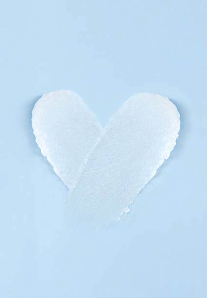 istock cosmetic smears scrub cream texture on pastel blue background 1473443845